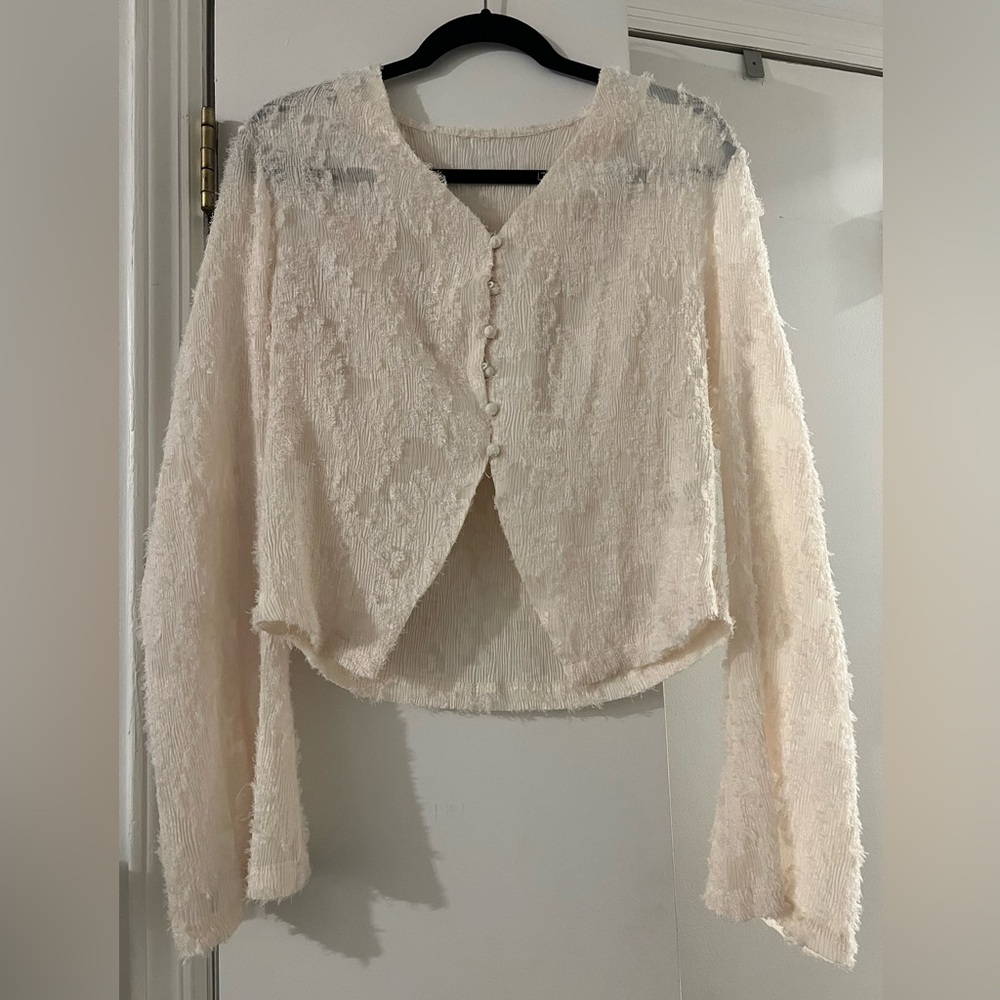 Cream top with bottoned front